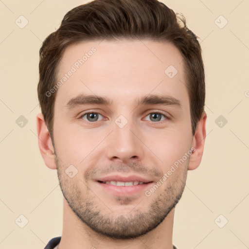 Joyful white young-adult male with short  brown hair and grey eyes