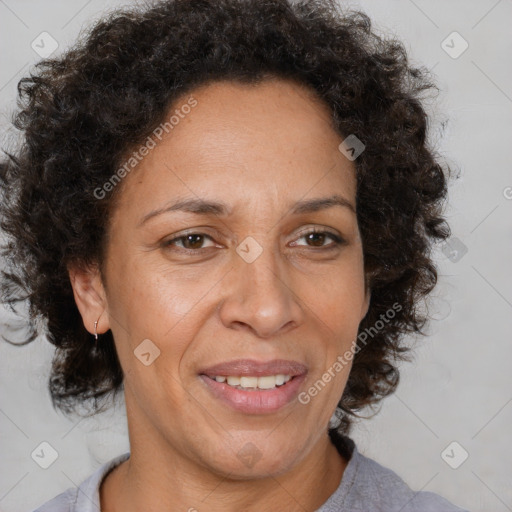 Joyful black adult female with medium  brown hair and brown eyes