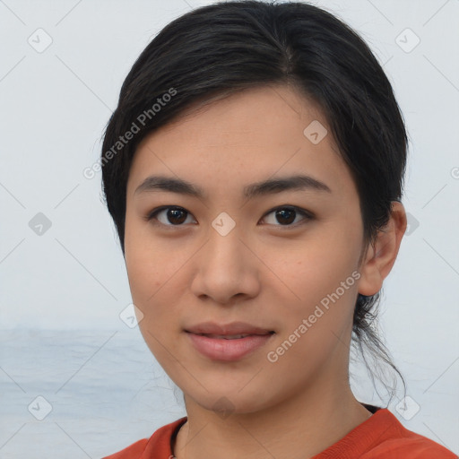 Joyful asian young-adult female with medium  black hair and brown eyes