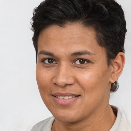 Joyful white adult female with short  brown hair and brown eyes