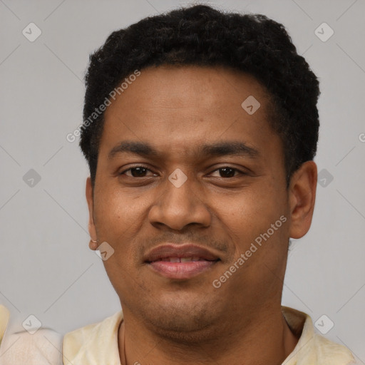 Joyful latino young-adult male with short  brown hair and brown eyes