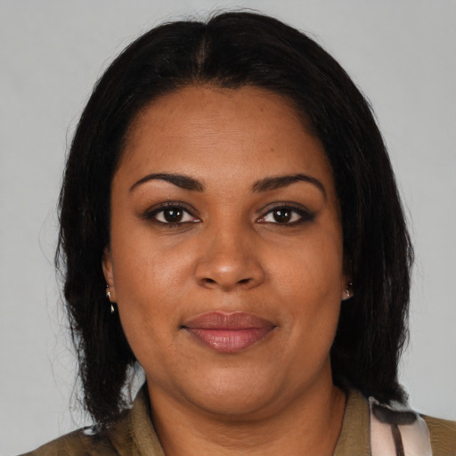 Joyful black young-adult female with medium  brown hair and brown eyes