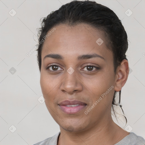 Joyful latino young-adult female with short  black hair and brown eyes