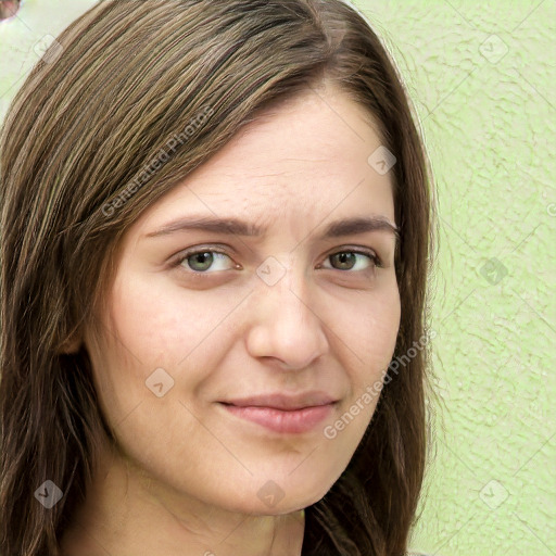 Joyful white young-adult female with long  brown hair and green eyes