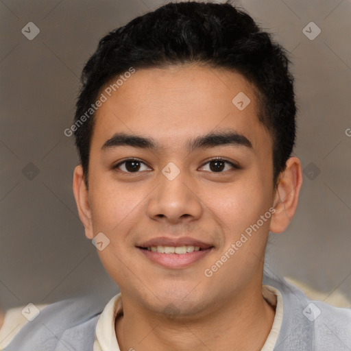 Joyful latino young-adult male with short  brown hair and brown eyes