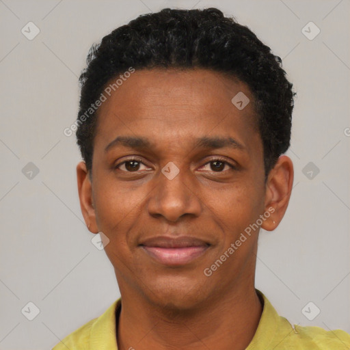 Joyful black young-adult male with short  black hair and brown eyes