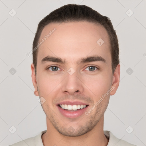 Joyful white young-adult male with short  brown hair and brown eyes