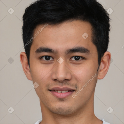 Joyful asian young-adult male with short  black hair and brown eyes