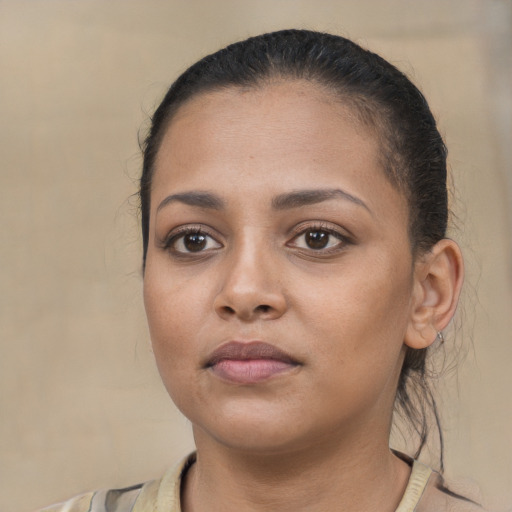 Neutral white young-adult female with short  brown hair and brown eyes