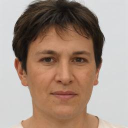 Joyful white adult female with short  brown hair and brown eyes