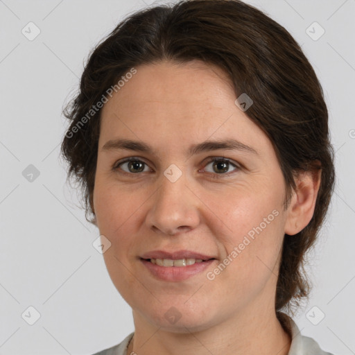 Joyful white adult female with medium  brown hair and grey eyes