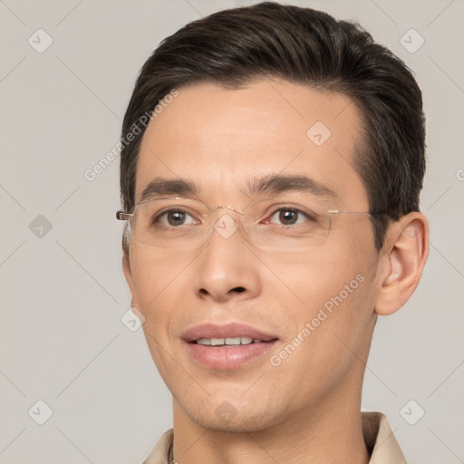 Joyful white adult male with short  brown hair and brown eyes