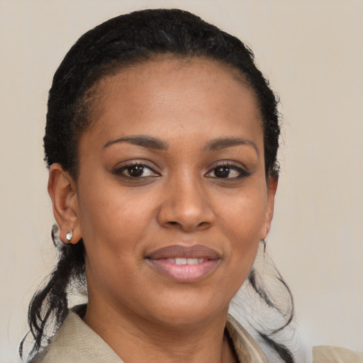 Joyful black young-adult female with medium  brown hair and brown eyes