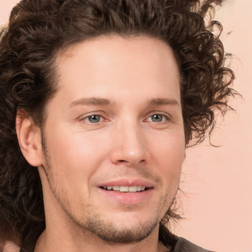 Joyful white young-adult male with medium  brown hair and brown eyes