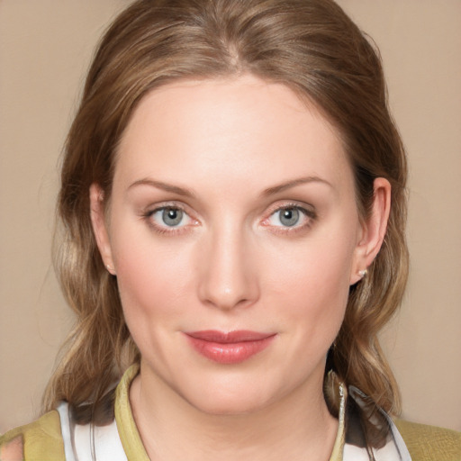 Joyful white young-adult female with medium  brown hair and blue eyes