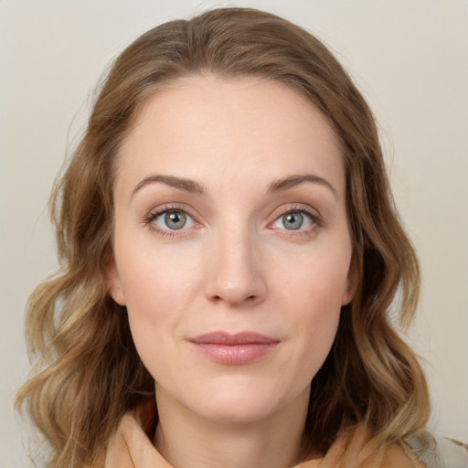 Joyful white young-adult female with medium  brown hair and blue eyes