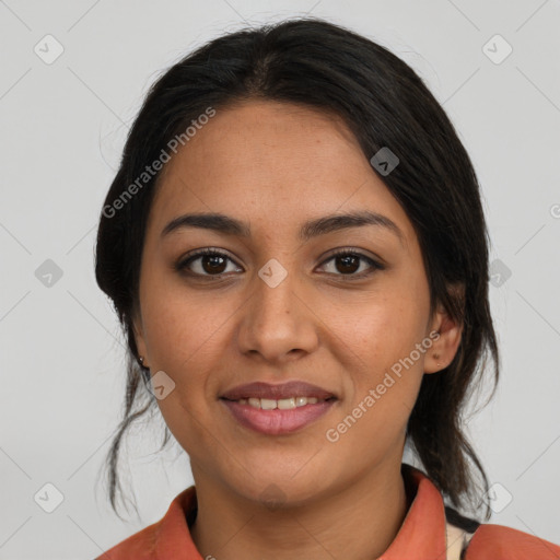 Joyful latino young-adult female with medium  brown hair and brown eyes