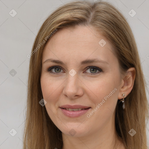 Joyful white adult female with long  brown hair and brown eyes