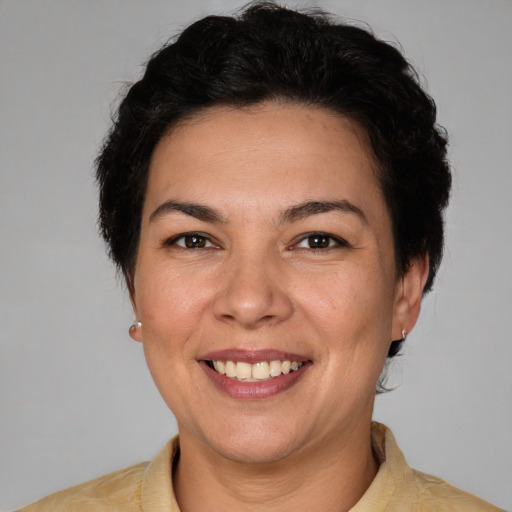 Joyful white adult female with short  brown hair and brown eyes