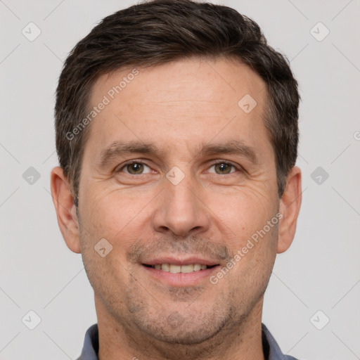 Joyful white adult male with short  brown hair and brown eyes