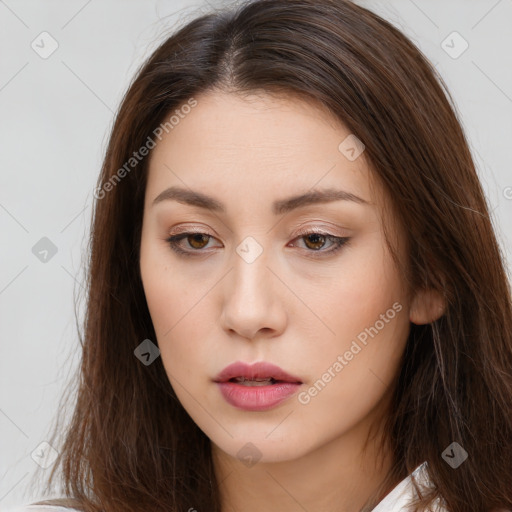 Neutral white young-adult female with long  brown hair and brown eyes