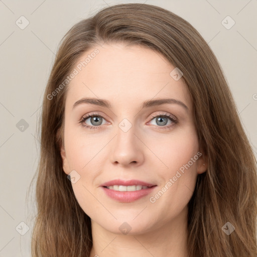 Joyful white young-adult female with long  brown hair and green eyes