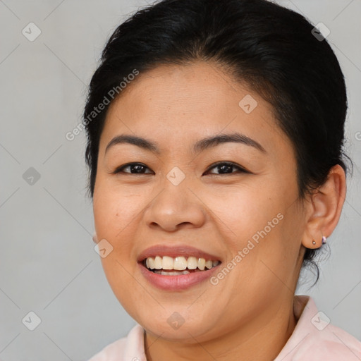 Joyful asian young-adult female with medium  brown hair and brown eyes