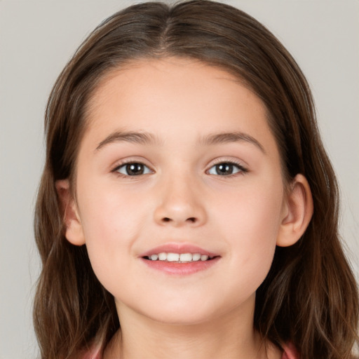 Joyful white child female with long  brown hair and brown eyes