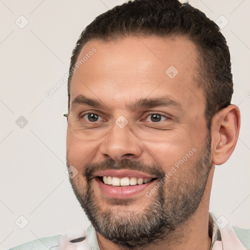 Joyful white young-adult male with short  brown hair and brown eyes