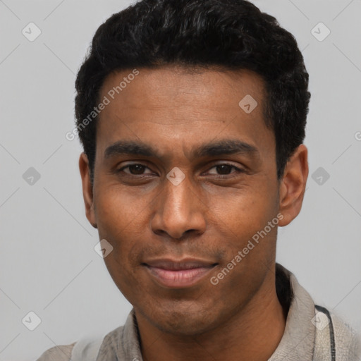 Joyful latino young-adult male with short  black hair and brown eyes