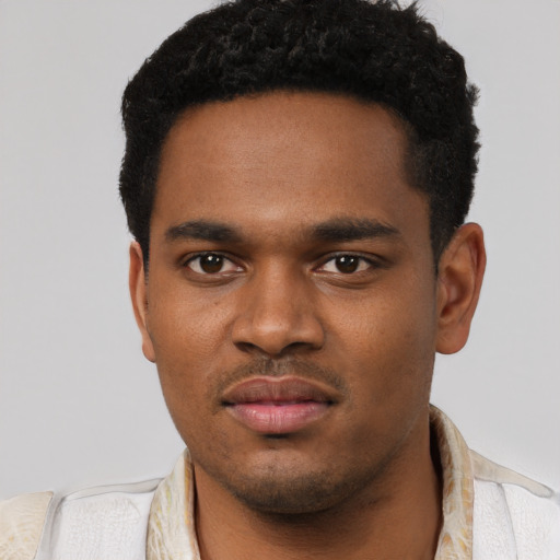 Neutral black young-adult male with short  black hair and brown eyes