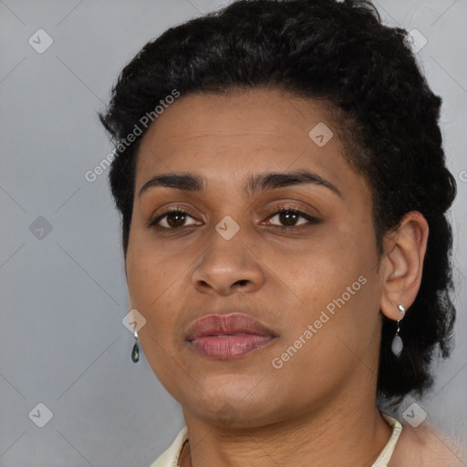 Joyful latino young-adult female with short  brown hair and brown eyes