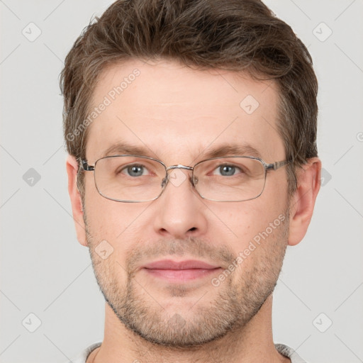 Joyful white adult male with short  brown hair and grey eyes