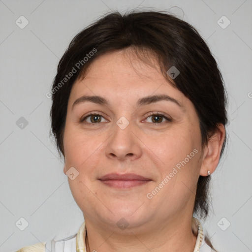 Joyful white adult female with medium  brown hair and brown eyes