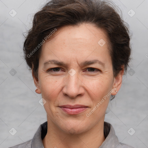 Joyful white adult female with short  brown hair and brown eyes