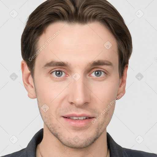 Joyful white young-adult male with short  brown hair and grey eyes