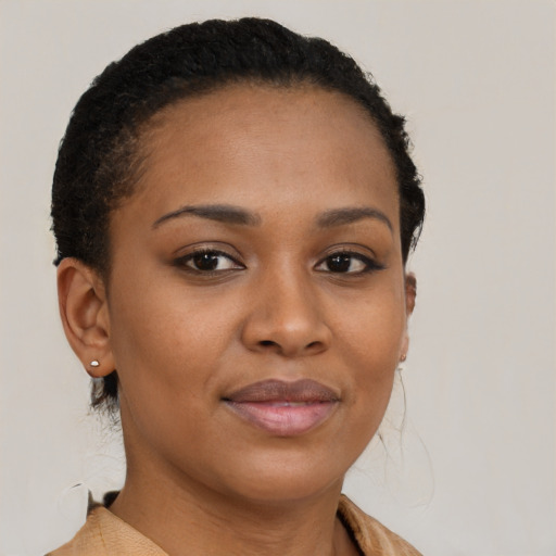 Joyful black young-adult female with short  brown hair and brown eyes
