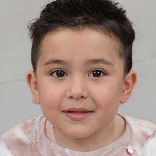 Joyful white child male with short  brown hair and brown eyes