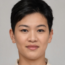 Joyful asian young-adult female with short  black hair and brown eyes