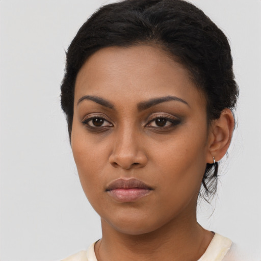 Neutral latino young-adult female with long  black hair and brown eyes