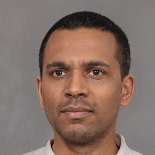 Neutral black young-adult male with short  black hair and brown eyes