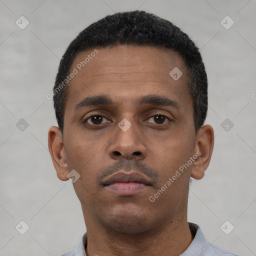 Neutral latino young-adult male with short  black hair and brown eyes