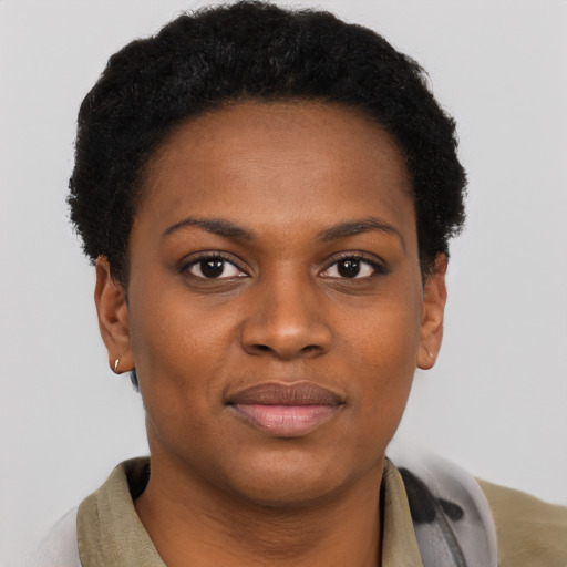Joyful black young-adult female with short  brown hair and brown eyes