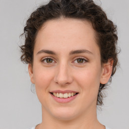 Joyful white young-adult female with medium  brown hair and green eyes