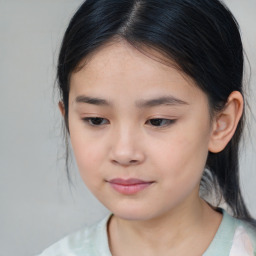 Joyful asian child female with medium  brown hair and brown eyes