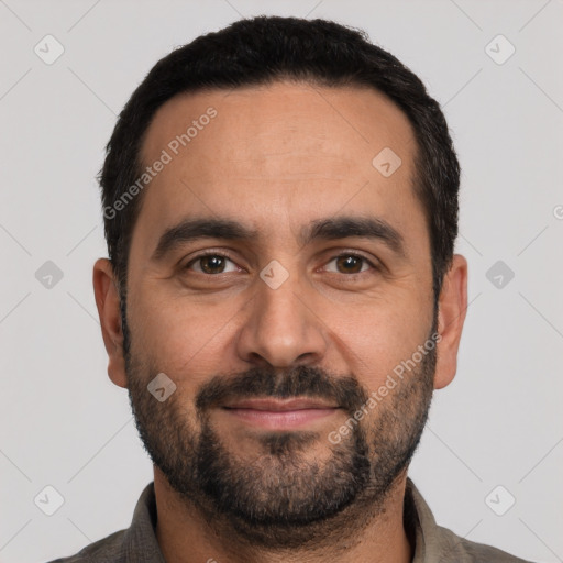 Joyful white adult male with short  black hair and brown eyes