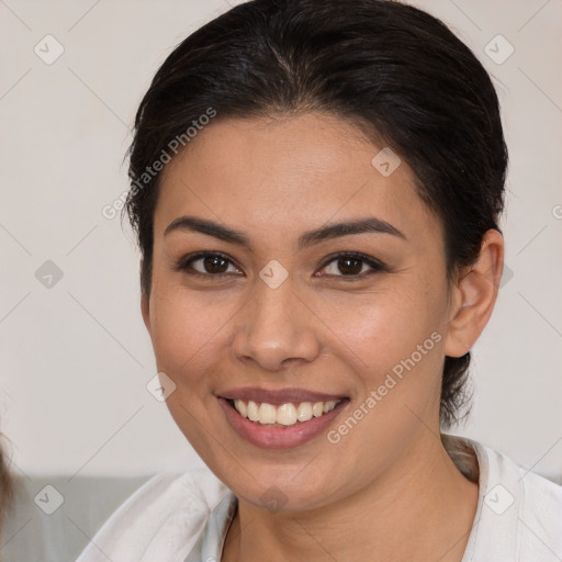 Joyful white young-adult female with medium  brown hair and brown eyes