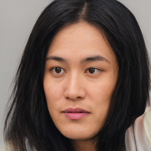 Joyful asian young-adult female with long  black hair and brown eyes