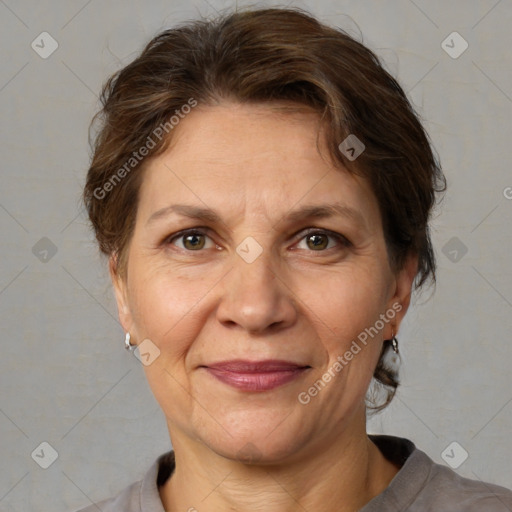 Joyful white adult female with medium  brown hair and grey eyes