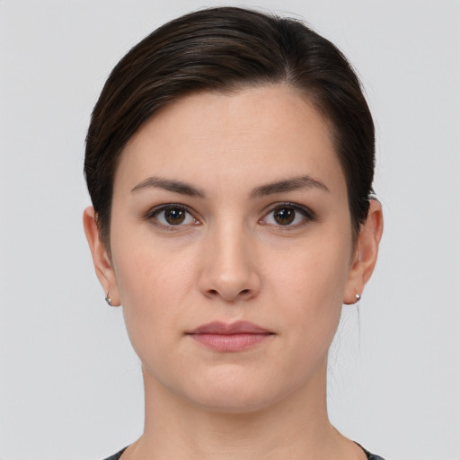 Neutral white young-adult female with short  brown hair and brown eyes